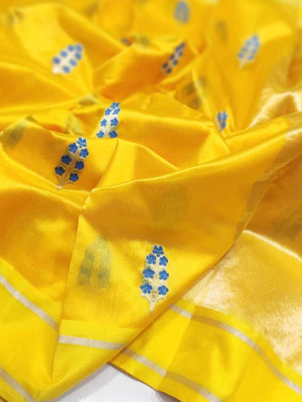 Yellow Pattu Silk Chanderi saree showing blue floral sprig motifs