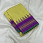 folded chartreuse checked kanchipuram silk saree with purple border and green selvedge