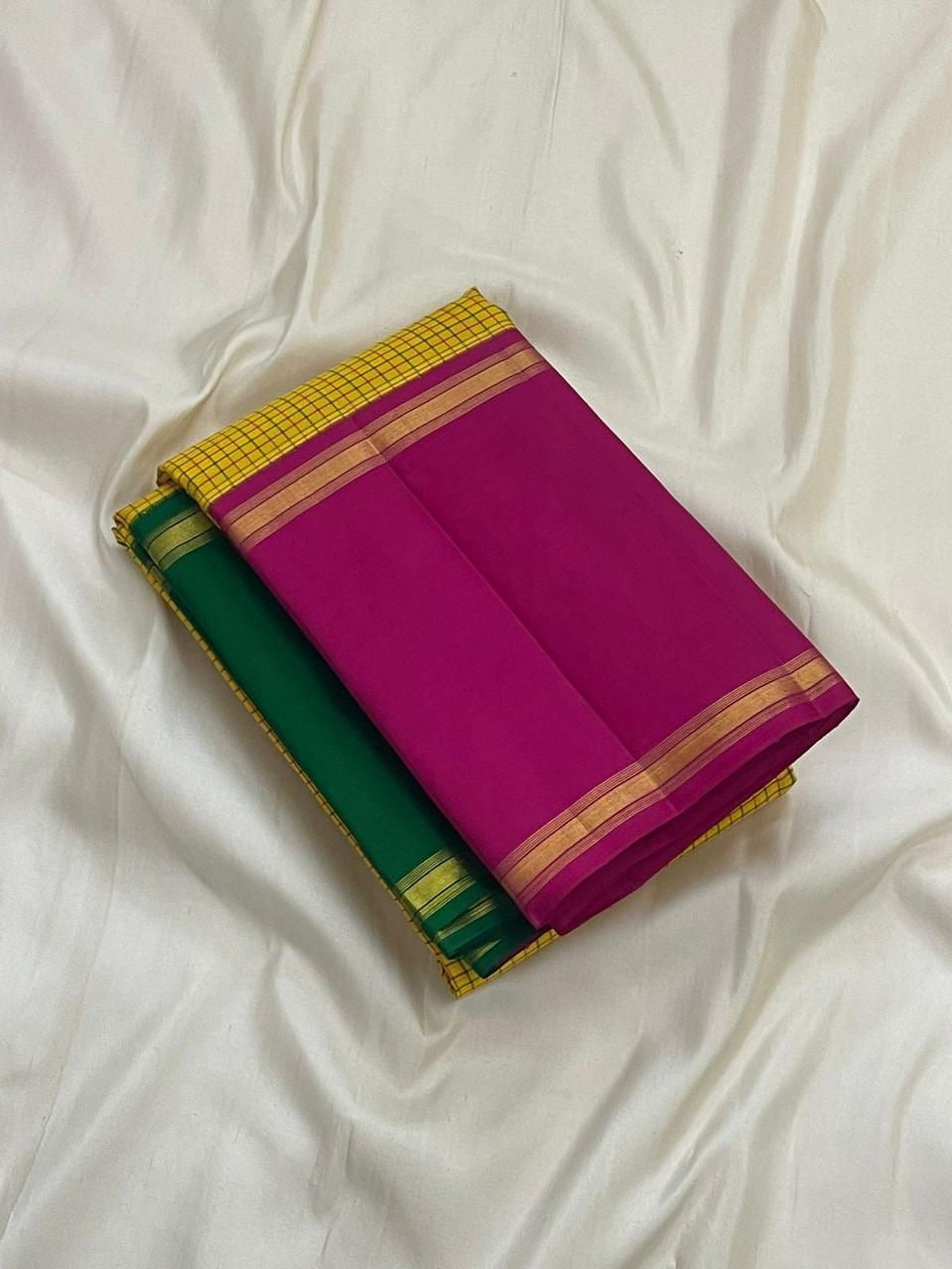 folded sunflower yellow checked kanchipuram silk saree with magenta zari border