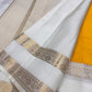 Gold zari kattam checks and Kamalam buttas on marigold Kanjivaram saree