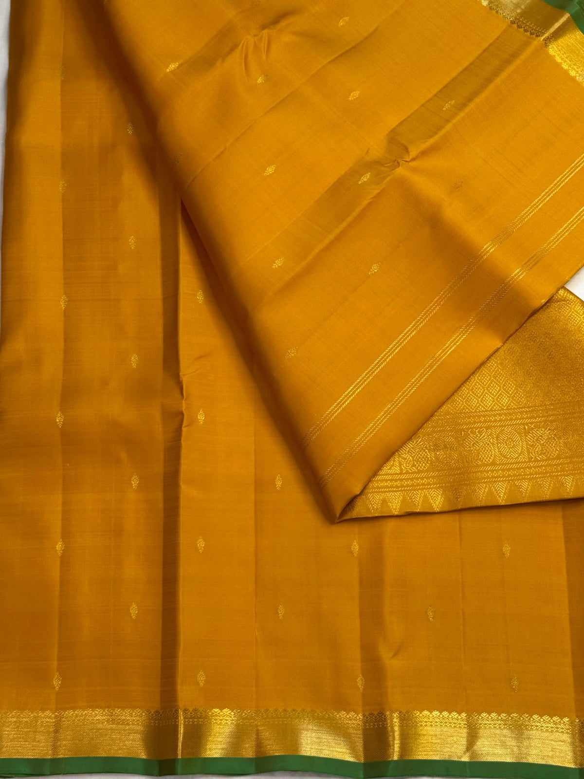 Close-up of small zari border on manjal turmeric gold Kanjivaram saree