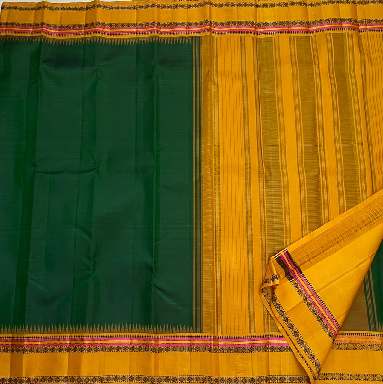 Handwoven forest green Kanchipuram Pattupet saree with golden yellow Korvai pallu — Idam Living