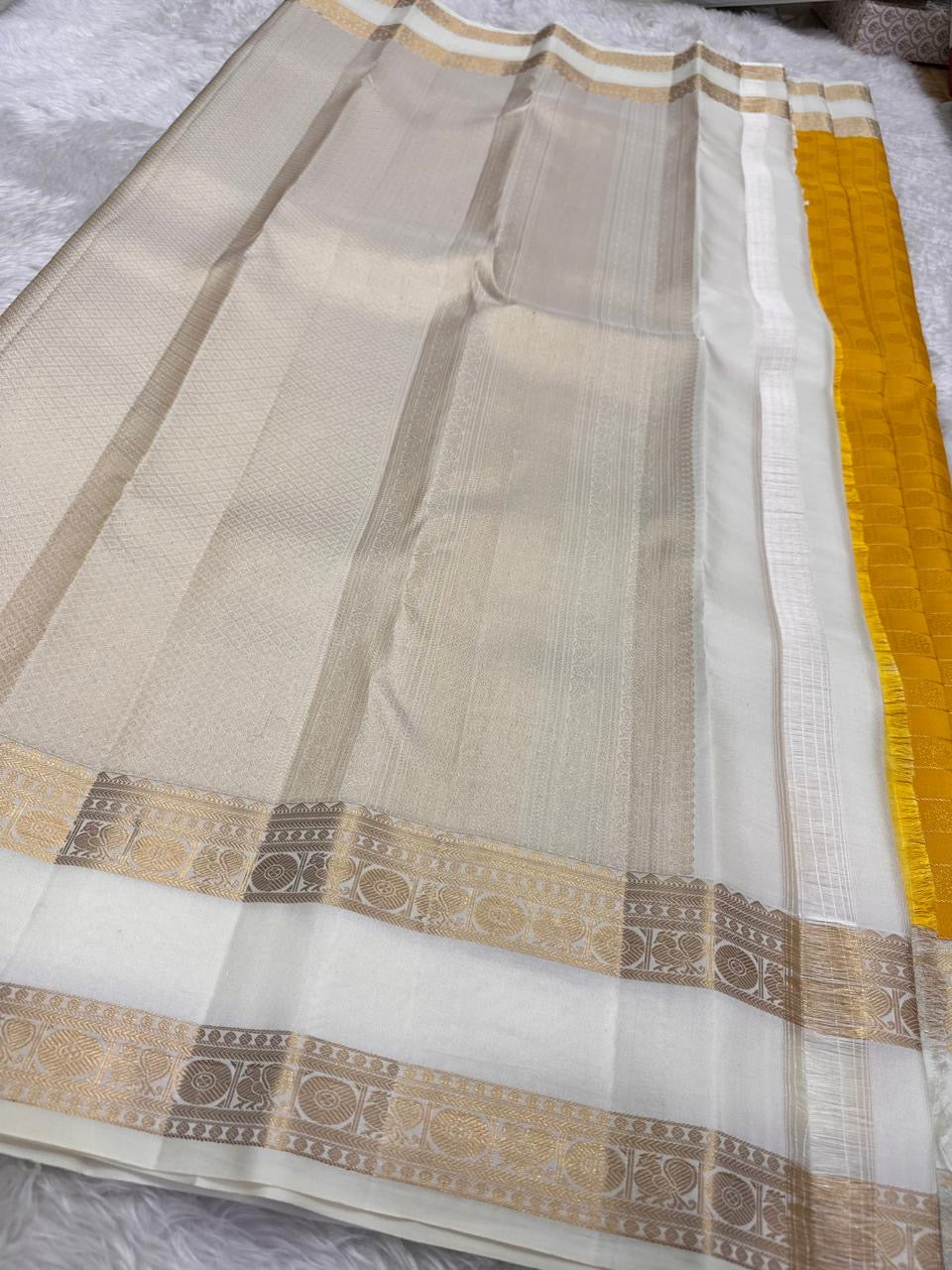 Marigold pure silk Kanjivaram saree, folded view — Idam Living