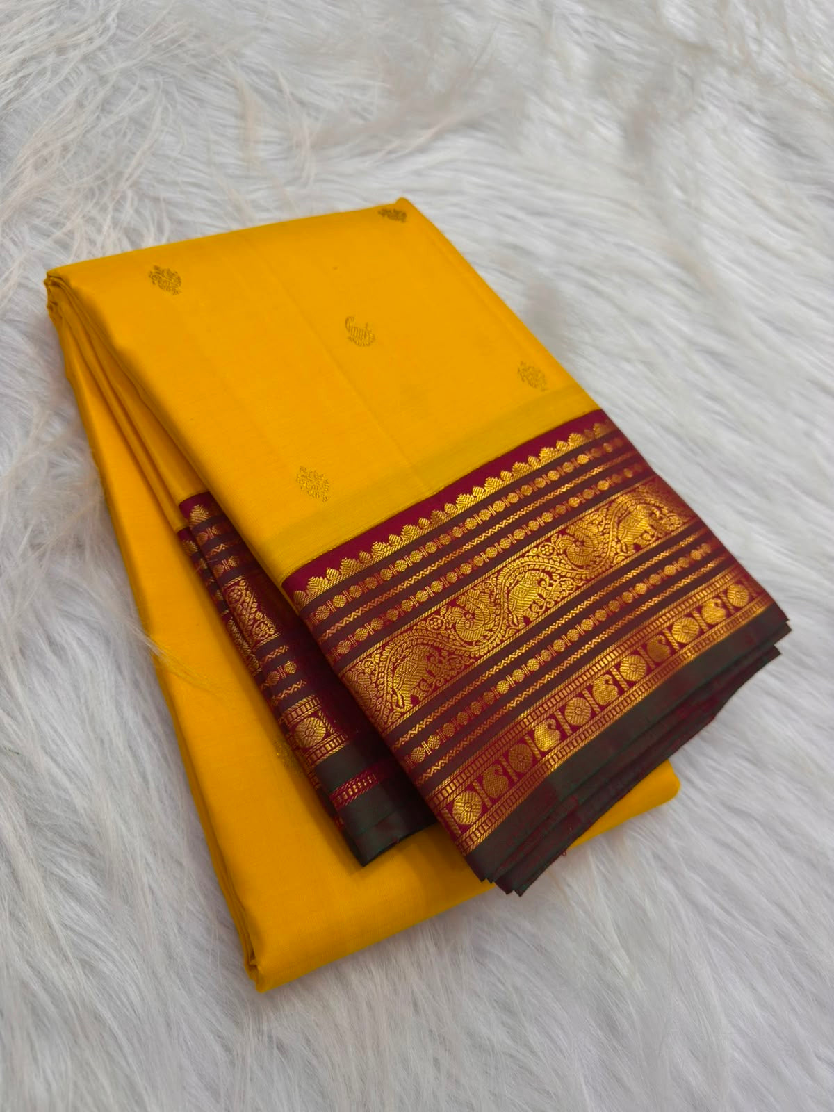 Manjal yellow pure silk Kancheepuram Korvai saree, folded view — Idam Living