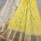 Detailed Kamalam gold-zari buttas on mellow-yellow silk