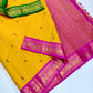 Golden-yellow vintage Ganga Jamuna Korvai Kanchi Pattu saree with petal-pink and green borders