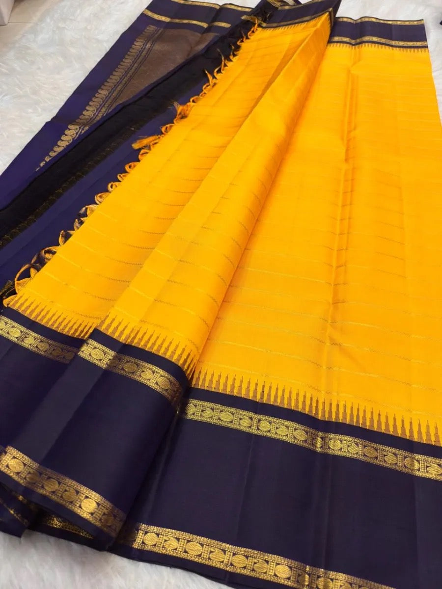 Yellow Pure Silk Kanchipuram saree with dark Indigo Rettapet border