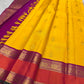 Yellow Korvai saree showing jewel-purple, coral-orange and antique-gold layered border details.