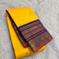 Close view of Kalam paisley buttas on the yellow silk body of a Kanchipuram saree