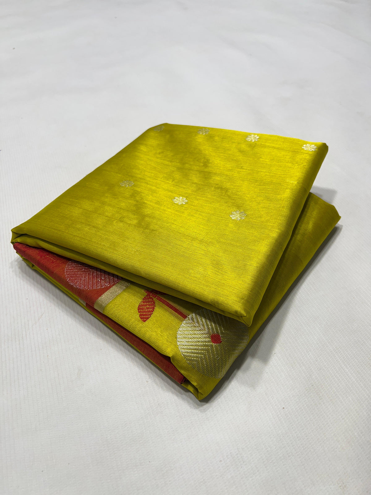Yellow and red handloom Pattu Silk Chanderi saree draped to show body and border