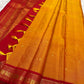 Mango mambazham yellow Kanchipuram silk saree pleated view highlighting subtle antique gold butta and contrast border