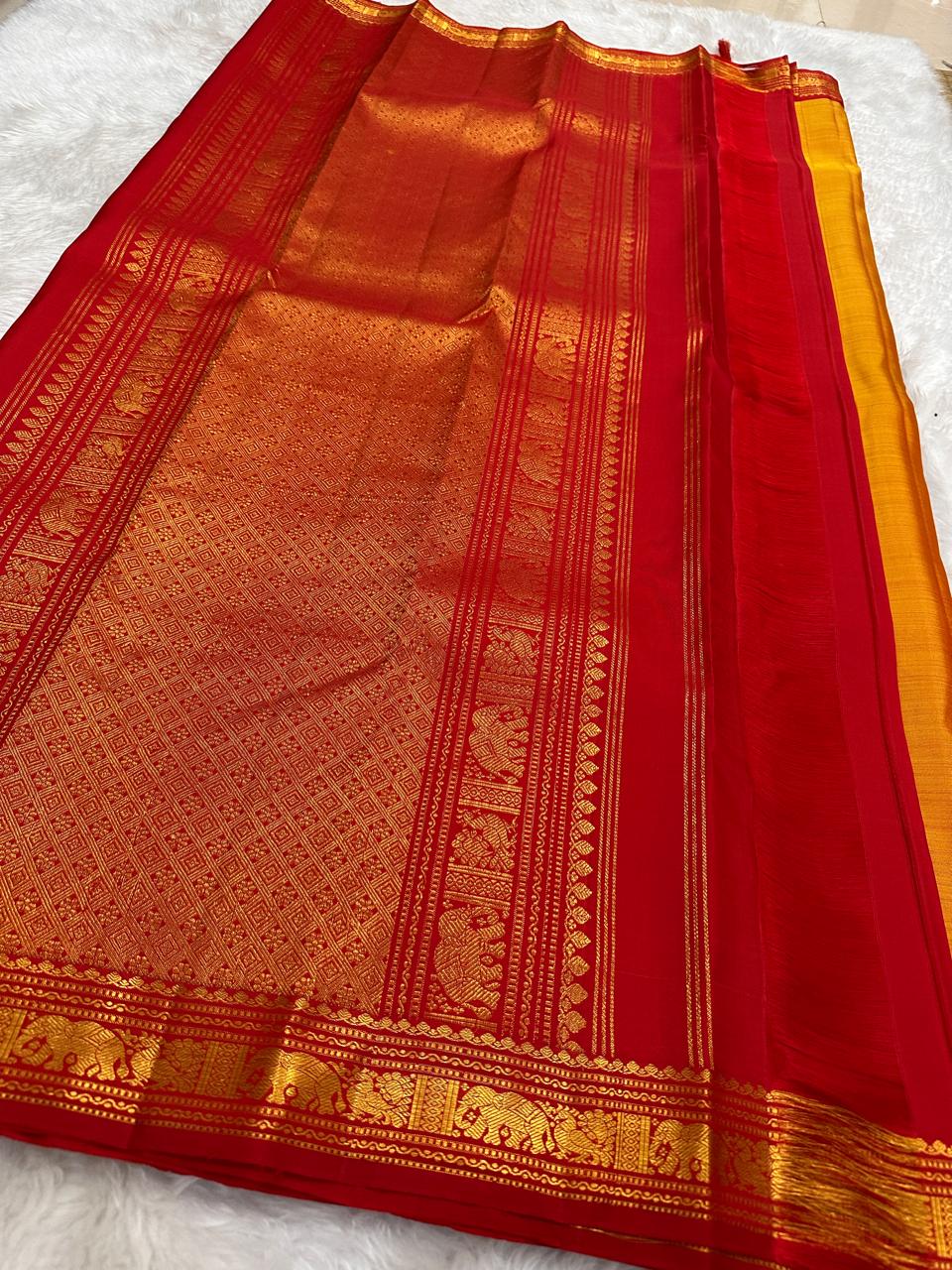 Full length view of mango mambazham yellow pure silk Kanchipuram saree with red antique gold zari border and pallu