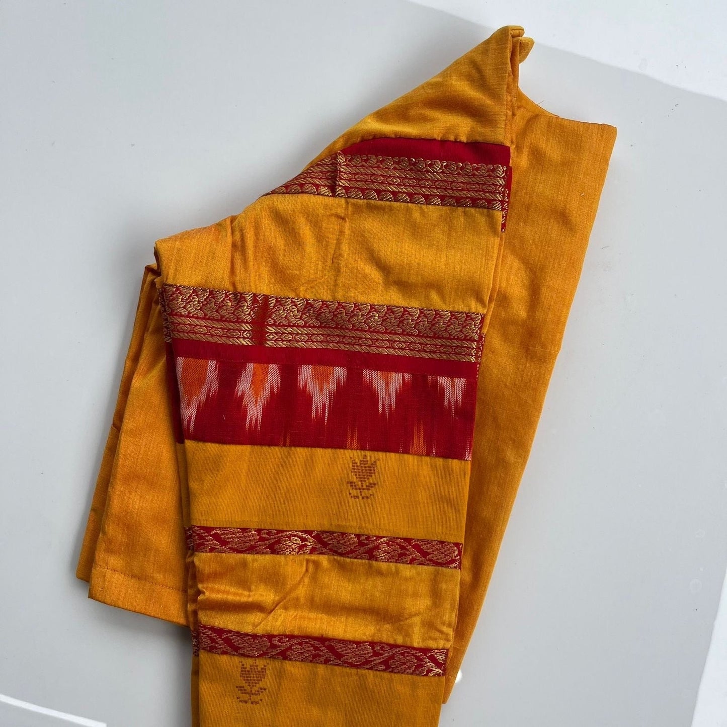 Small batch handcrafted yellow blouse with ikkat weave and festive zari finish