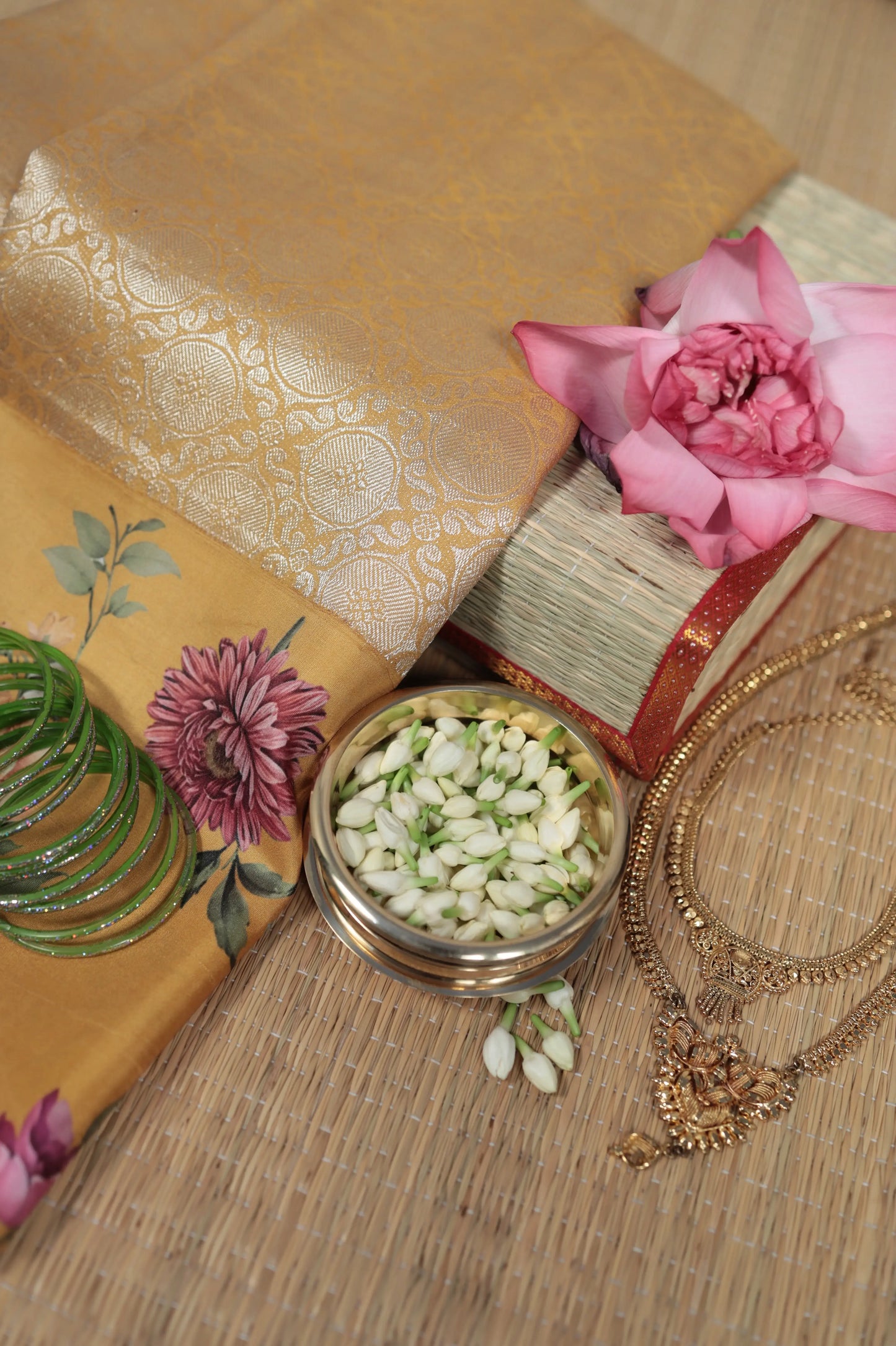 Yellow Kancheepuram silk saree featuring soft gardenia floral patterns with lightweight traditional zari finish