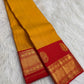 Turmeric Yellow and Vermilion Red Pure Silk Kanchipuram composition.