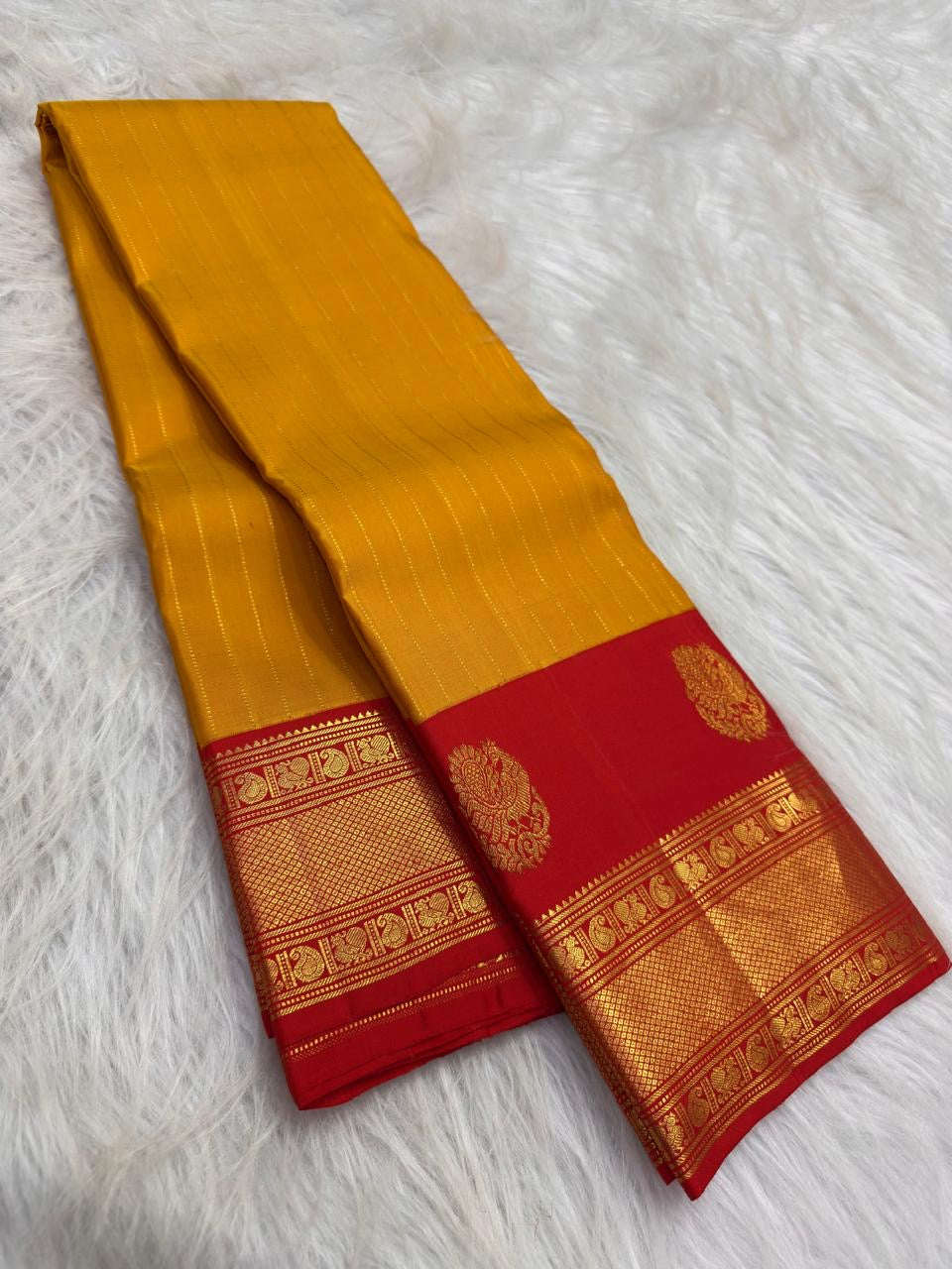 Turmeric Yellow and Vermilion Red Pure Silk Kanchipuram composition.