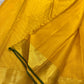 Thick antique gold zari woven border with floral and geometric motifs on yellow Kanjivaram saree