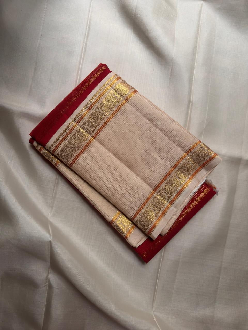 Arakku red Kanchipuram silk saree, grand pallu with broad gold zari panels and lattice section