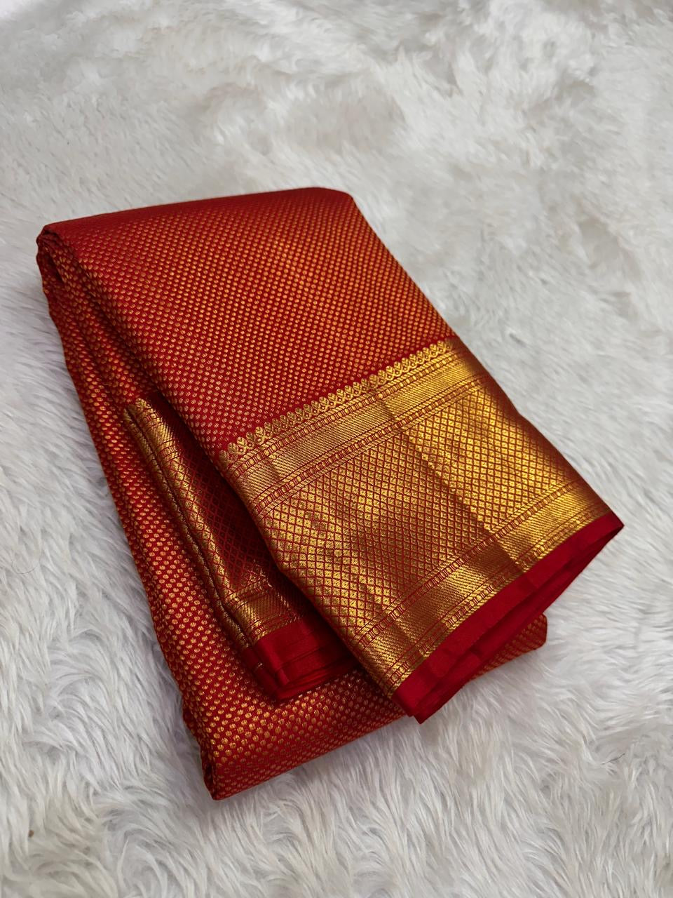 vermilion red Kanchipuram silk saree with zk weave folded view